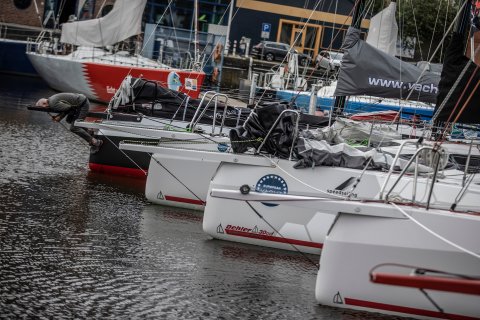 racing boat fleet ready to sail