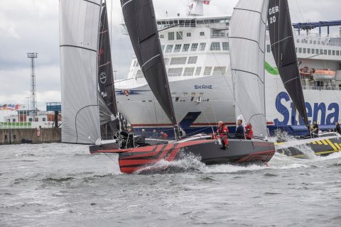 race boats passing the ferry